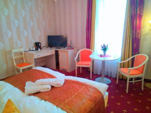 Voodi või voodid majutusasutuse Alexa Hotel toas