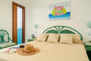 A bed or beds in a room at Appartamenti Baia di Citara