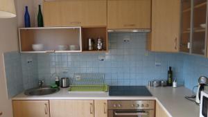 a kitchen with a sink and a counter top at Muranów Studio in Warsaw