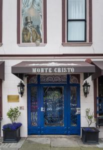 a store front with a blue door and a sign at Monte Cristo Bed and Breakfast in San Francisco