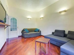 a living room with a couch and a table at Folia Domus - Vatican City in Rome