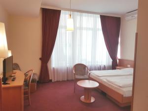 Postel nebo postele na pokoji v ubytování Hotel Haydn