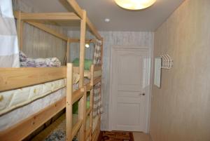 a room with a bunk bed and a window at Hostel Gurtyeva in Oryol