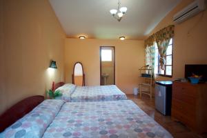 Postel nebo postele na pokoji v ubytování La Pintada Inn