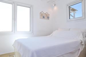 Cama ou camas em um quarto em La Maison Blanche