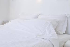 Cama ou camas em um quarto em La Maison Blanche