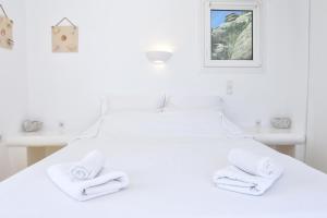Cama ou camas em um quarto em La Maison Blanche