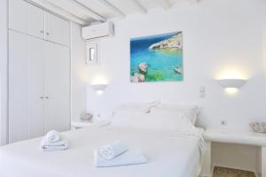 Cama ou camas em um quarto em La Maison Blanche