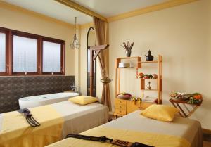 Postel nebo postele na pokoji v ubytování Adiwana Resort Jembawan