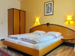 Postel nebo postele na pokoji v ubytování Hotel Kull von Schmidsfelden