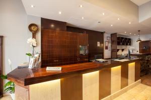 a kitchen with a long counter in a room at Hotel Don Paco in Málaga