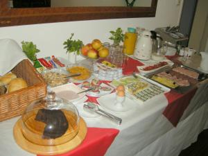 a table with a buffet of food on it at Pension Schottentor in Vienna