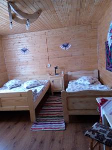 Postel nebo postele na pokoji v ubytování Cabana Ghetari