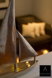 a model of a paper boat on a table at Hotel Santa Maria in Saint-Florent