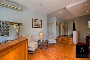a living room with two chairs and a table at Hotel Santa Maria in Saint-Florent