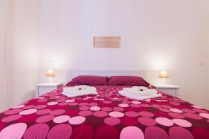 Posteľ alebo postele v izbe v ubytovaní Maison Ortigia