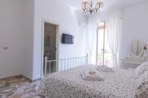 Posteľ alebo postele v izbe v ubytovaní Maison Ortigia