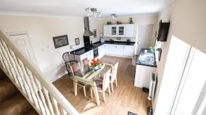 a kitchen and dining room with a table and chairs at Marvene in Thornaby on Tees