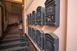 a row of lockers on the wall of a hallway at Cathedral Apartment in Lviv