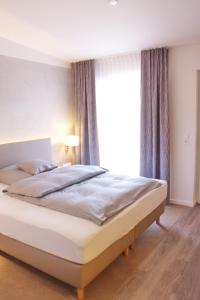 Postel nebo postele na pokoji v ubytování Stichwehs Hotel am Bahnhof