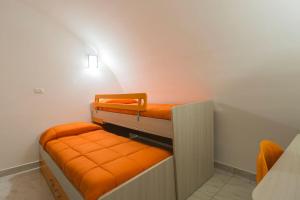 Двухъярусная кровать или двухъярусные кровати в номере Casa Celentano
