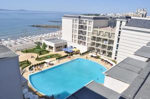 an overhead view of a swimming pool next to a beach at Private Studio 1st line in Pomorie