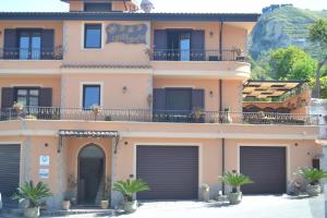 a building with garage doors in front of it at Villa Sofia in Parghelia