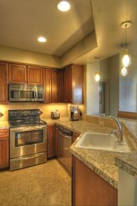 a kitchen with a sink and a stove at Casitas at Sabino Springs in Tucson