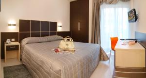 Postel nebo postele na pokoji v ubytování Hotel Garnì Corallo + 29 fotografií