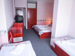 Postel nebo postele na pokoji v ubytování Classic Hotel