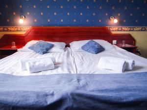 Postel nebo postele na pokoji v ubytování Classic Hotel