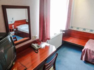 Postel nebo postele na pokoji v ubytování Classic Hotel
