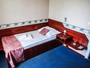 Postel nebo postele na pokoji v ubytování Classic Hotel