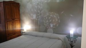 Giường trong phòng chung tại Alla Finestra Sul Parco