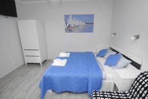 Posteľ alebo postele v izbe v ubytovaní Mazuria Apartamenty