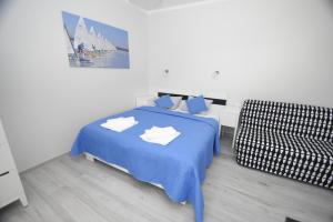 Posteľ alebo postele v izbe v ubytovaní Mazuria Apartamenty