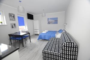Posteľ alebo postele v izbe v ubytovaní Mazuria Apartamenty