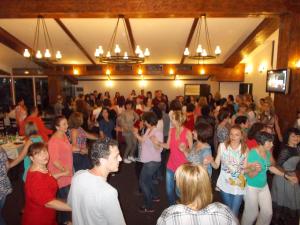 a large crowd of people dancing in a room at Motel Koziyat Rog in Malko Tŭrnovo +56 photos