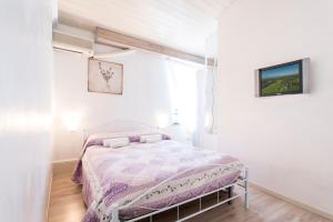 Ένα ή περισσότερα κρεβάτια σε δωμάτιο στο Sisi Apartment & Rooms