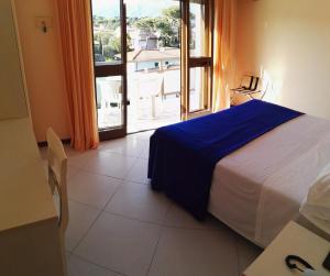 Postel nebo postele na pokoji v ubytování Hotel Elizabeth