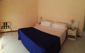 Postel nebo postele na pokoji v ubytování Hotel Elizabeth