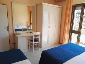 Postel nebo postele na pokoji v ubytování Hotel Elizabeth