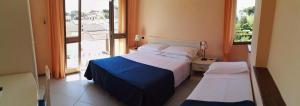 Postel nebo postele na pokoji v ubytování Hotel Elizabeth
