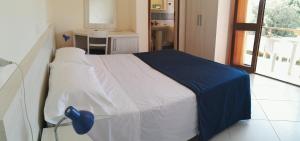 Postel nebo postele na pokoji v ubytování Hotel Elizabeth