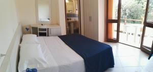 Postel nebo postele na pokoji v ubytování Hotel Elizabeth