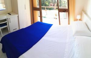 Postel nebo postele na pokoji v ubytování Hotel Elizabeth