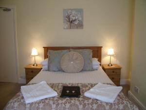 Кровать или кровати в номере Britannia Guest House
