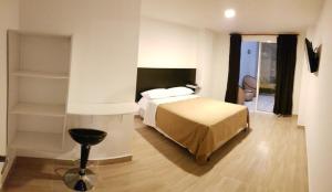 En eller flere senge i et værelse på Hotel Villa Blanca