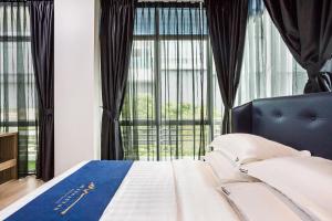 Postel nebo postele na pokoji v ubytování Manhattan Business Hotel TTDI