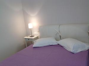Postel nebo postele na pokoji v ubytování Apartments Aliki